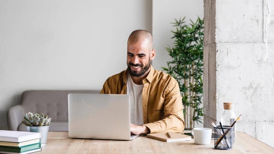 man on computer executing seo strategies